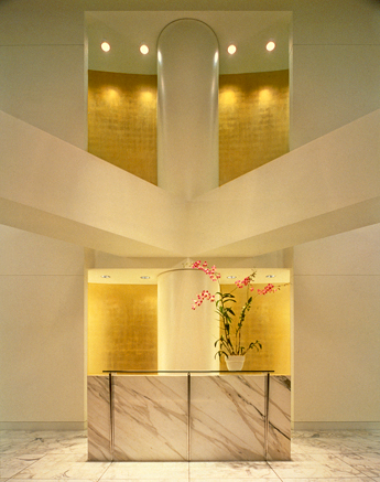 Main Reception Area, View of Reception Desk with Two-Story Architectural Feature Wall
