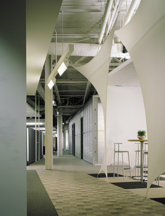 Typical Office Corridor with View of Workstations, Private Offices and Breakout Space